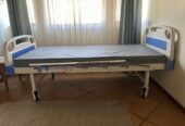 Two crank hospital bed in good condition for sale.