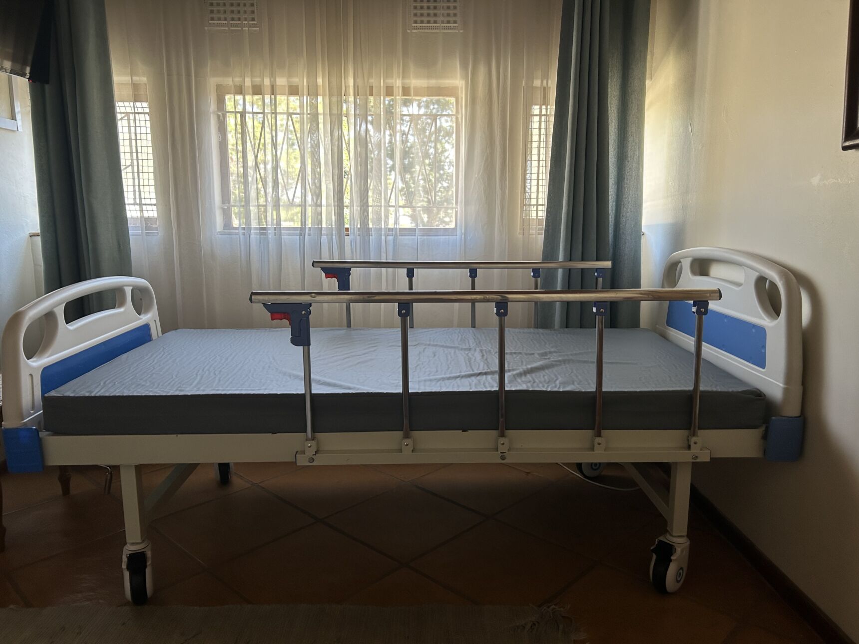 Two crank hospital bed in good condition for sale.